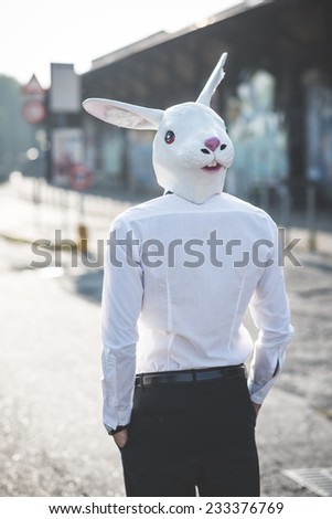 rabbit mask young handsome elegant blonde model man in the city