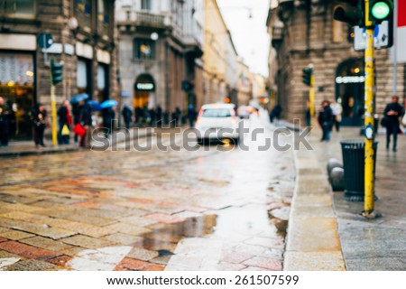 intentional blurred city and people urban milan scene background - those kind of images are strongly in demands