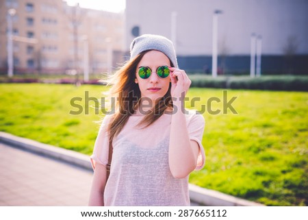 young beautiful blonde hipster woman in the city