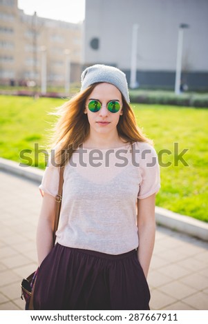 young beautiful blonde hipster woman in the city