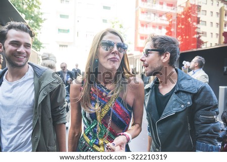 MILAN, ITALY - SEPTEMBER 25: People during Milan Fashion week, Italy on SEPTEMBER 25, 2015. Eccentric and fashionable people waiting for models and vips outside city during Milan fashion week