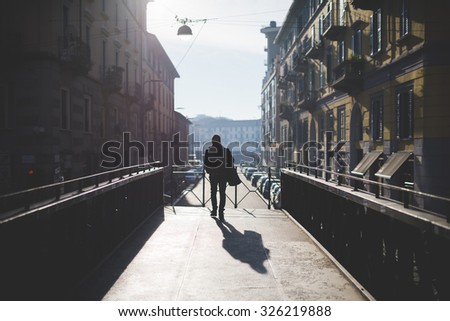 Similar – Foto Bild Gegenlichtlandschaftsbild mit Brücke, Fluss und Strommast