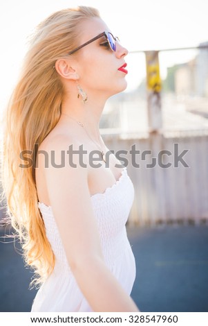 Half length profile of young handsome caucasian long blonde straight hair woman, looking left, pensive - thinking future, freedom, youth concept