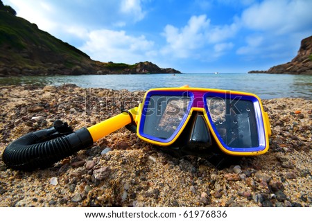 diving mask and snorkel on the beach in summer