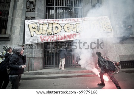 MILAN, ITALY - JANUARY 28: student demonstration held in Milan January 28, 2011. Students protest against Berlusconi\'s government calling for his resignation from the government.