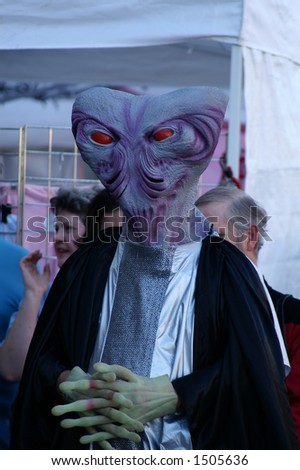 Three quarter closeup of gray headed alien in the Alien costume contest, Roswell UFO Festival 2006, Roswell New Mexico.