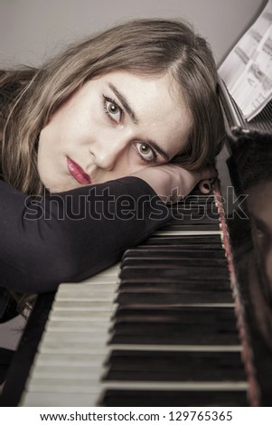 Portrait of young woman pianist close up