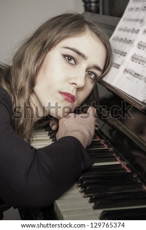 Portrait of young woman pianist close up