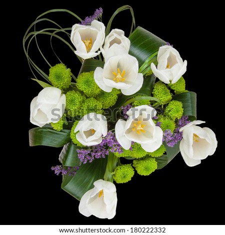 Bouquet of white tulips isolated on a black background