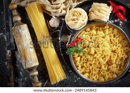 Similar – Image, Stock Photo Composition of pasta and kitchenware on table