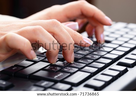 Typing on keyboard.
