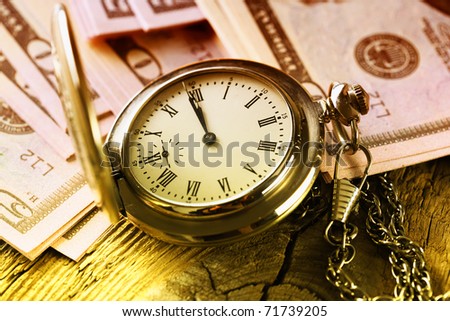 money-time.Pocket watch and dollars