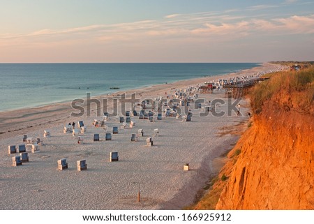 Similar – Foto Bild Rotes Kliff an der Küste der Insel Sylt bei Sonnenuntergang.  Leere Strandkulisse an der Nordsee