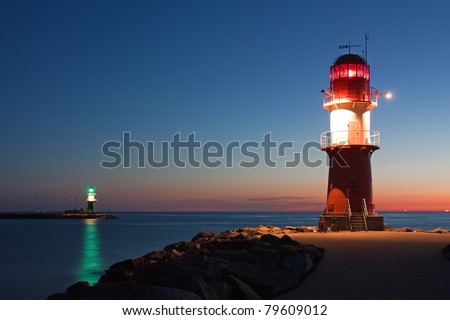 Lighthouses at night at the Baltic Sea, harbour entrance of Rostock-Warnemuende, Mecklenburg-Vorpommern, Germany