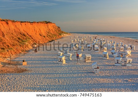 Similar – Foto Bild Rotes Kliff an der Küste der Insel Sylt bei Sonnenuntergang.  Leere Strandkulisse an der Nordsee