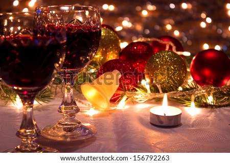 Red wine, ornaments and candles as a New Year decoration, New Year decorations, photography