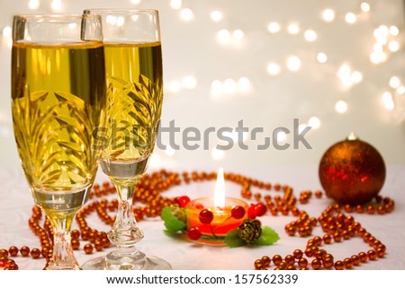 Beautiful ornaments, candles and champagne as a New Year decoration, New Year decorations, photography