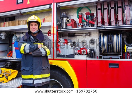 Fireman standing by fire engine, Fireman, photography