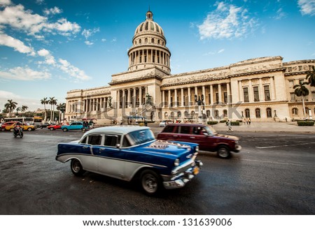 HAVANA-JUNE 7: Old car rides in front of the Capitol on June 7, 2011 in Havana. Before a new law issued on October 2011, cubans could only trade cars that were on the road before 1959.