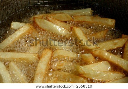 french fries cooking in hot oil