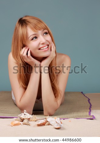 cute caucasian girl on a fake studio beach