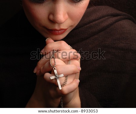 a woman is praying to god with hope