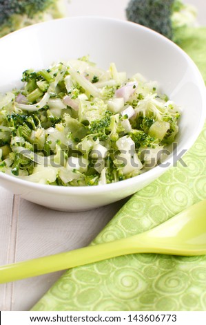Green chopped salad with broccoli, onion and cucumber