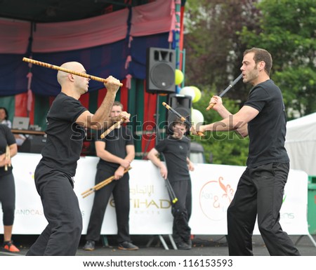 BRUSSELS, BELGIUM-JUNE 10: Two unidentified performers show martial arts exercise during Asia & U festival on June 10, 2012 in Brussels. This is public annual festival of Asian cultures in Belgium.