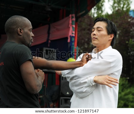 BRUSSELS, BELGIUM-JUNE 10: Unidentified participants show martial arts during Asia & U festival on June 10, 2012 in Brussels. This is annual festival of Asian cultures in Belgium