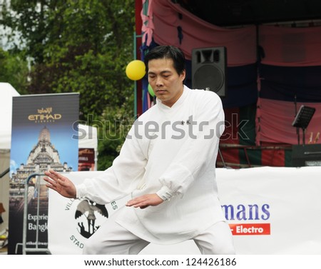 BRUSSELS, BELGIUM-JUNE 10: Unidentified performer shows martial arts exercise during Asia & U festival on June 10, 2012 in Brussels. This is annual festival of Asian cultures in Belgium