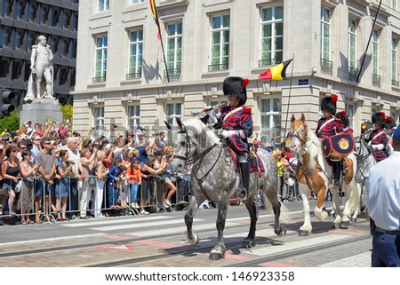 BRUSSELS, BELGIUM - JULY, 21: Belgian Cavalry moves to Place des Palais during ceremony of National Day of Belgium on July 21, 2013 in Brussels