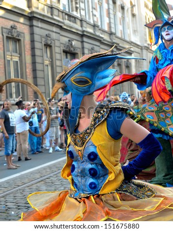 BRUSSELS, BELGIUM-JULY 21: Unidentified street actors play scene in defile during Belgian National Day activities on July 21, 2013 in Brussels.