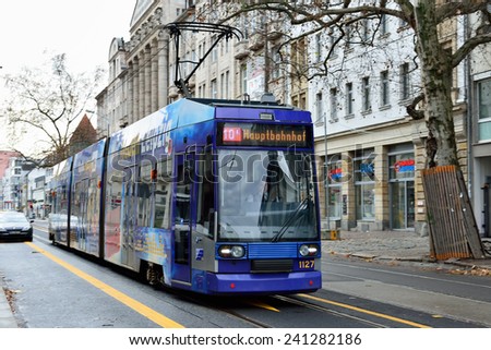 LEIPZIG, GERMANY-DECEMBER 21, 2014: Tram moves through central part of Leipzig. Trams often used for advertisement exposure in the city.