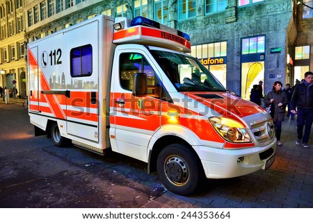 LEIPZIG, GERMANY-DECEMBER 21, 2014: Vehicle of Feuerwehr Emergency service on duty during Christmas market. This public service with phone number 112 is available in many European countries