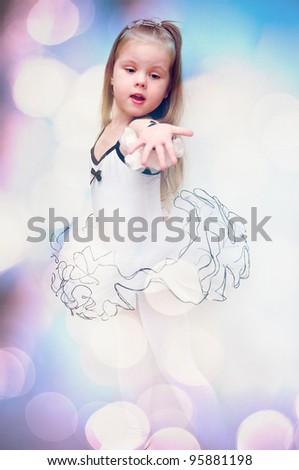 Lovely little girl, dressed as a ballerina, isolated on white background