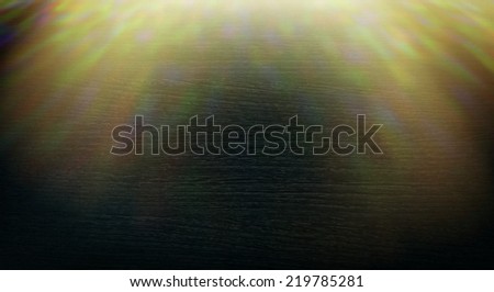 dark wooden background with abstract sunlights
