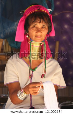 CHIANG RAI, THAILAND - FEB 26 : Karen long neck hill tribe with traditional clothes and silver jewelery in hill tribe minority village on February 26, 2013 in Chiang Rai, Thailand