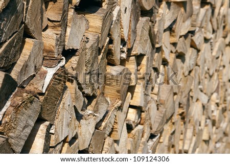 Chopped and stacked pile of pine and birch wood. Texture, background