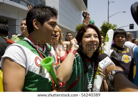 Los Angeles, California-June 17: Mexico supporters talk to cameras after World Cup win over France June 17, 2010 in Los Angeles, California