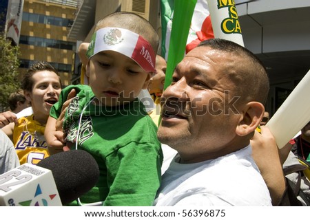 LOS ANGELES, CALIFORNIA-JUNE 17: Father and son talk to cameras after World Cup win over France June 17, 2010 in Los Angeles, California.