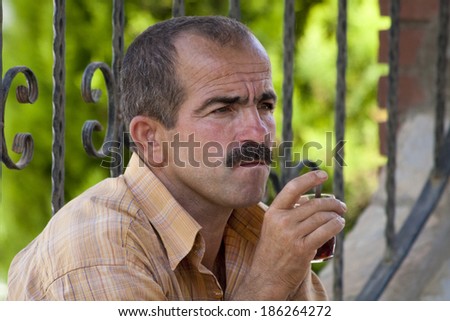 Alanya, Turkey-September 20th 2011: A Turkish man drinking tea. Turkey has the highest per capita tea consumption at 2.5kg per person.