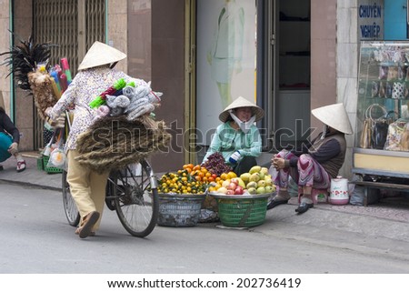 HO CHI MINH CITY, VIETNAM-NOV 3RD: Street vendors in Ho Chi Minh City on November 3rd 2013. Street vendors are a common site in Ho Chi Minh