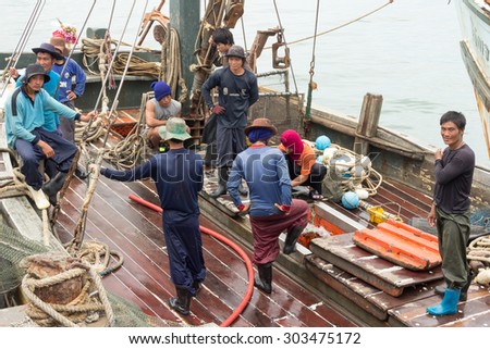 Hua Hin, Thailand-June 30th 2013: Burmese fishing crew onboard a Thai fishing boat. Most fishing boats are crewed by Burmese.