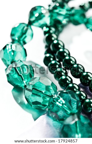 women\'s accessories: macro picture of green beads