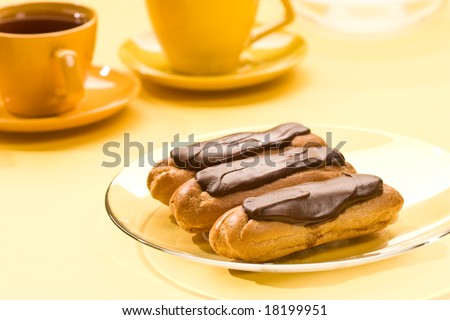 Chocolate  eclair. Still life with pastry filled custard