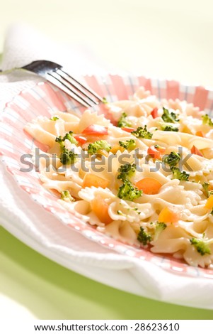 Macro picture of appetizing cooked pasta with vegetables