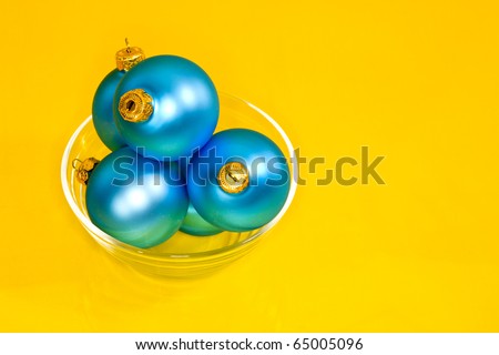 Holiday series: christmas blue ball on yellow