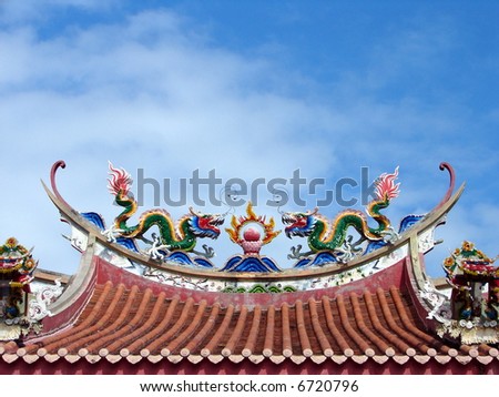 Colorful Dragons & the fire ball, on top of the roof of Chinese temple
