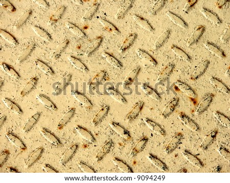 Beige-colored metal stamping plate texture