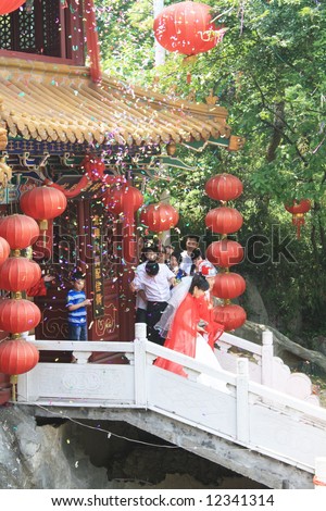 Chinese couple\'s wedding in oriental temple: Traditional culture